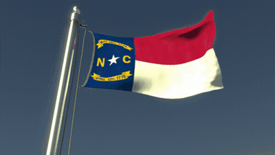 NC Flag Flying In Blue Sky GIF