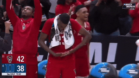 Nc State Player Gesturing Like Holding Baby GIF