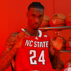Nc State Wolfpack Holding Jersey Proudly GIF