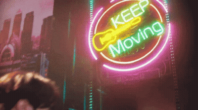 Neon Sign Saying Keep Moving GIF