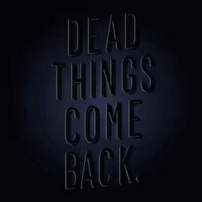 Neon Sign That Says Dead Things Come Back On A Dark Background GIF