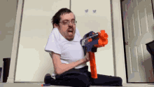 Nerdy Guy Epic Toy Gun GIF