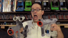 Nerdy Guy Holding Big Toy Gun GIF