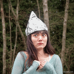Nervous Lady Wearing Tin Foil Hat GIF
