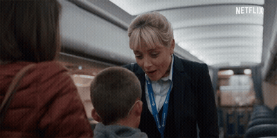 Netflix Ad Flight Attendant Talking To Boy GIF