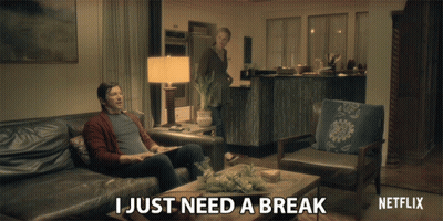 Netflix Ad Man Sitting On Couch Woman Behind GIF