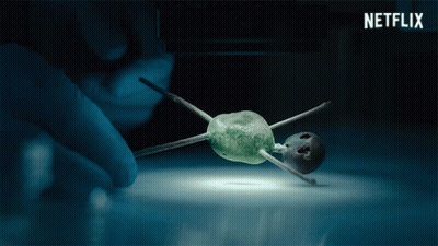 Netflix Ad Person Holding Tiny Object GIF
