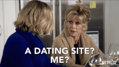Netflix Ad Two Women At Table Saying A Dating Site Me GIF