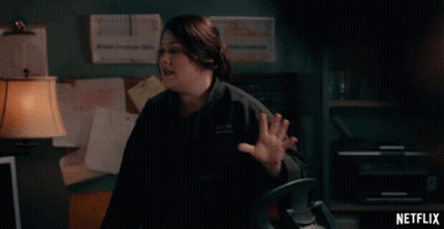 Netflix Ad Woman In Dark Office GIF