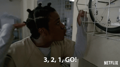 Netflix Ad Woman Pointing At Clock Saying 3 2 1 Go GIF