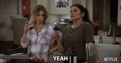 Netflix Ad Women Toasting With Wine GIF