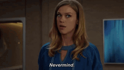 Nevermind Woman In Blue Looking Pissed GIF