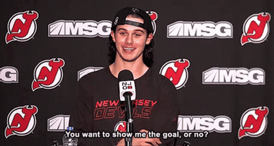 New Jersey Devils Shirt Man Talking Into Microphone
