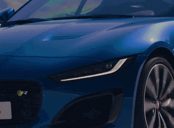 New Luxury Car Blue Jaguar Test Driving Fast