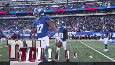New York Giants Football Player Holding Football GIF