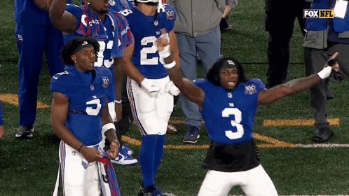 New York Giants Players Number 2 And 3 Are Celebrating On The Field GIF