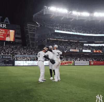 New York Yankees Baseball Players On The Field Hugging GIF