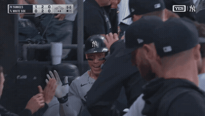 New York Yankees Player Surrounded By Teammates GIF