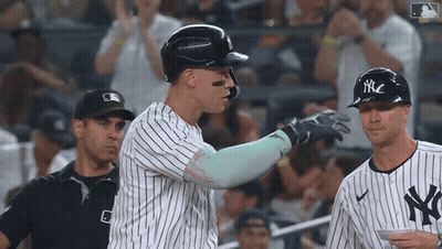 New York Yankees Player Surrounded By Teammates GIF