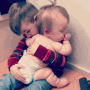 Newborn Baby Sister Brother Hug GIF