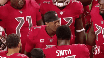 NFL Players Huddled With Smith Jersey GIF