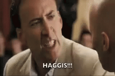 Nicolas Cage Making Funny Face Talking To Man In Crowd GIF