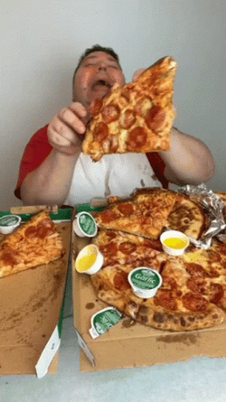 Nikocado Avocado Holds And Rubs Pizza On Face GIF