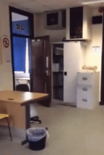 No Smoking Sign Above Door GIF