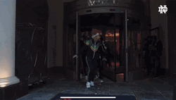 Notre Dame Guy Runs Out GIF