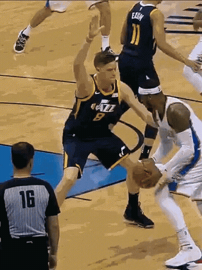 Number 9 Basketball Player Blocking Number 11 Player GIF