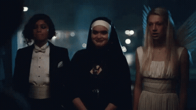 Nun And Two Angels Standing Together GIF