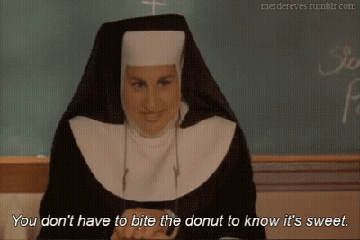 Nun By Chalkboard Says Don't Bite Donut GIF