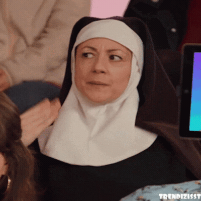 Nun Sitting At Tablet With Trendizisst GIF