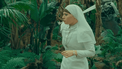 Nun Smoking Cigarette In Jungle GIF