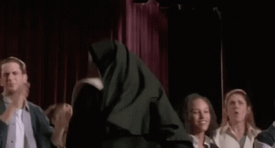 Nun Standing In Front Of Group GIF