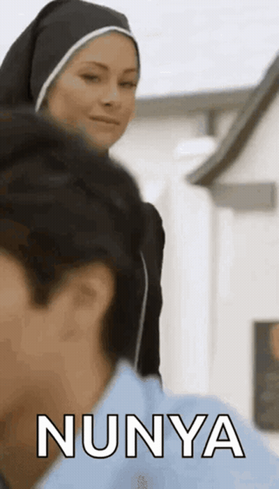 Nun Talking To Man In Blue Shirt GIF