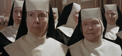 Nuns Standing In A Row Looking At Something GIF