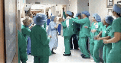 Nurses In Green Scrubs Dancing In Hospital Hallway GIF