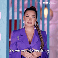 Offended Demi Lovato Wearing Purple Suit GIF