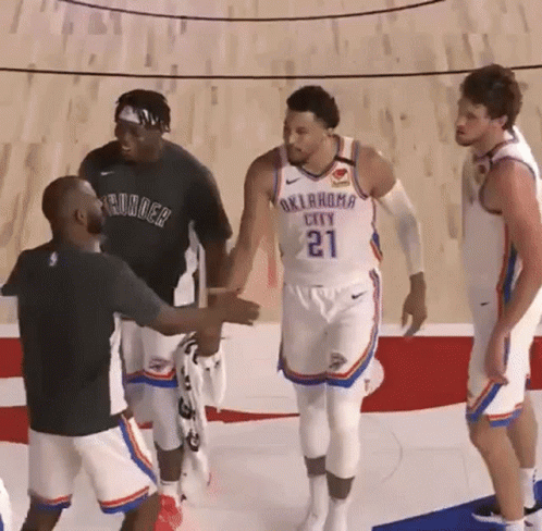 Oklahoma City Thunder Player Number 21 Shakes Hands With A Man GIF