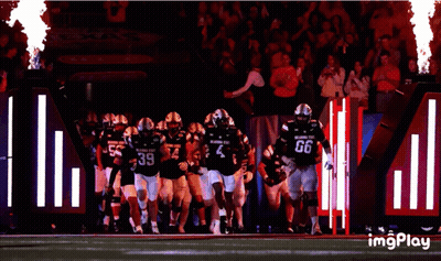 Oklahoma State Football Players Running On Field GIF