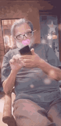 Old Man Browsing Phone With Filter