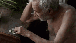 Old Man Counting Coins