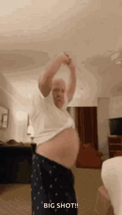 Older Man Dancing With Stick In Living Room GIF