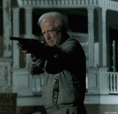 Older Man Holding Gun GIF