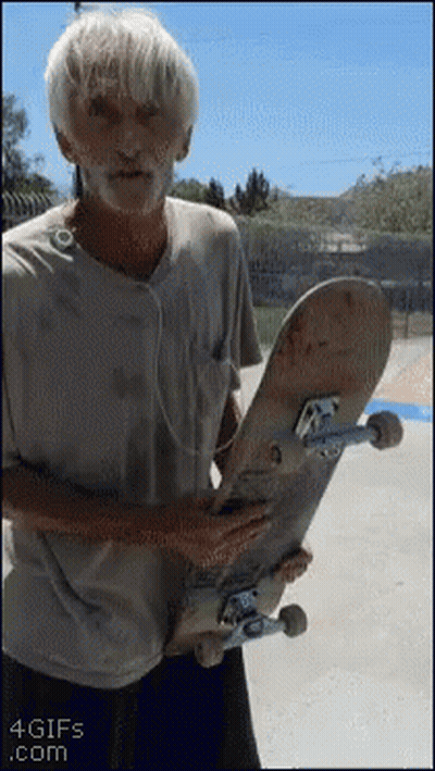 Older Man Holding Skateboard With 4gifs Watermark