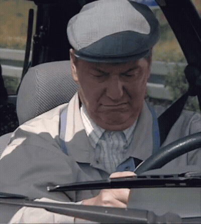 Older Man In Hat Sitting In Car GIF