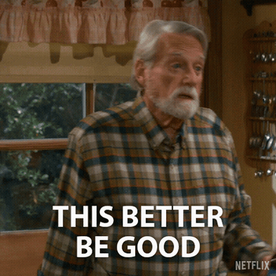 Older Man In Plaid Shirt Holding Beer Saying This Better Be Good GIF