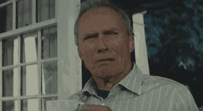Older Man In Striped Shirt Holding Coffee GIF