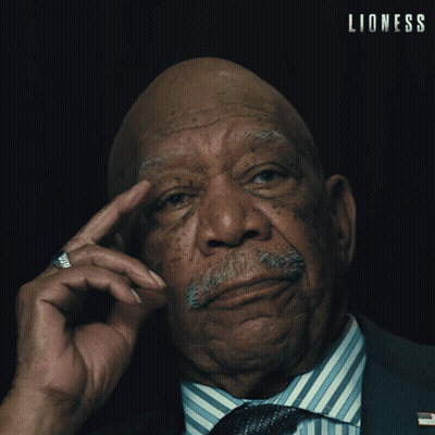 Older Man in Suit and Tie Saying Lioness